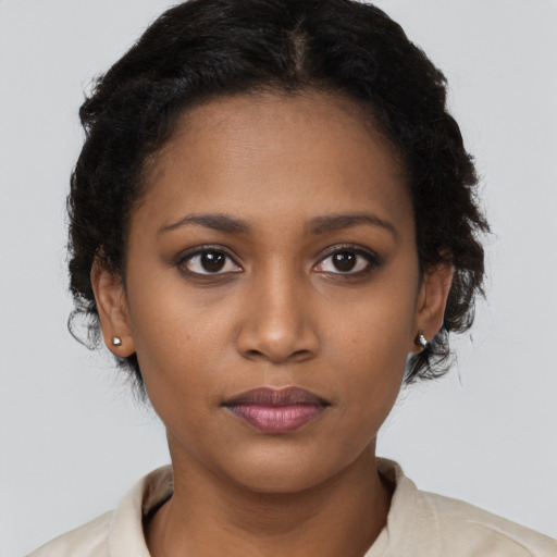 Neutral black young-adult female with short  brown hair and brown eyes
