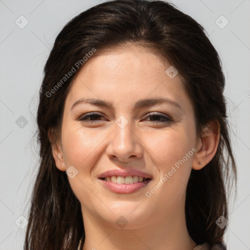 Joyful white young-adult female with long  brown hair and brown eyes