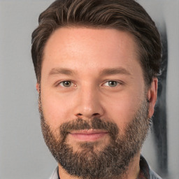 Joyful white adult male with short  brown hair and brown eyes