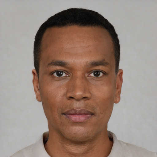Neutral black adult male with short  black hair and brown eyes