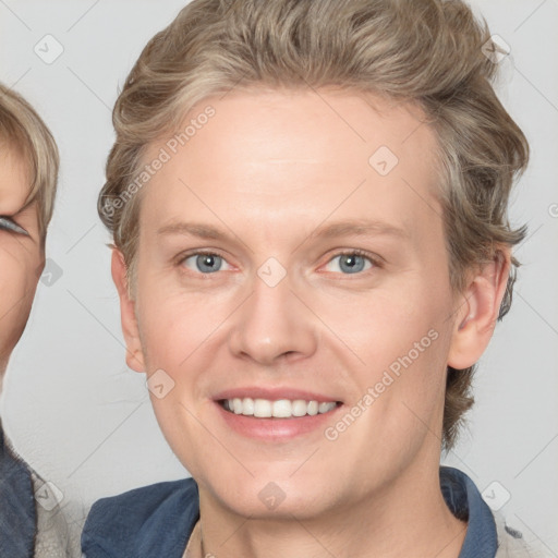 Joyful white young-adult female with medium  brown hair and blue eyes