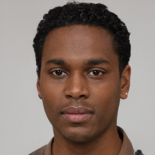 Neutral black young-adult male with short  black hair and brown eyes