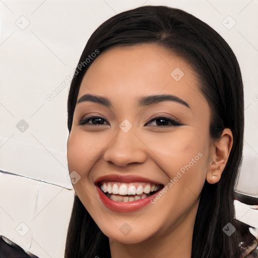 Joyful white young-adult female with long  black hair and brown eyes