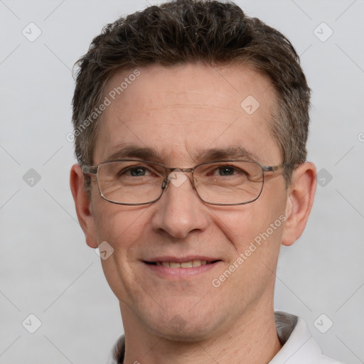 Joyful white adult male with short  brown hair and grey eyes