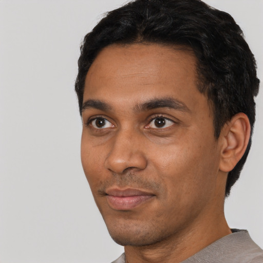 Neutral black young-adult male with short  black hair and brown eyes