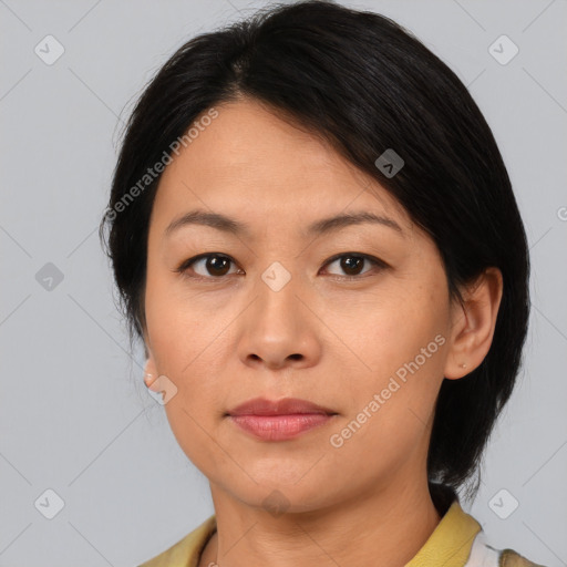 Joyful asian young-adult female with medium  brown hair and brown eyes