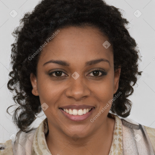 Joyful black young-adult female with long  brown hair and brown eyes