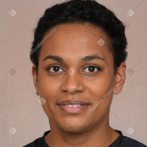 Joyful black young-adult female with short  brown hair and brown eyes