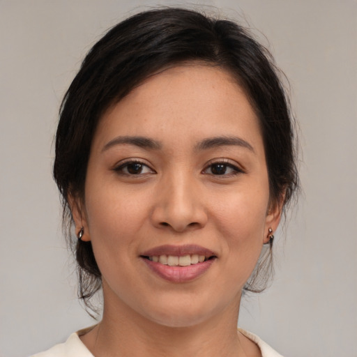 Joyful white young-adult female with medium  brown hair and brown eyes