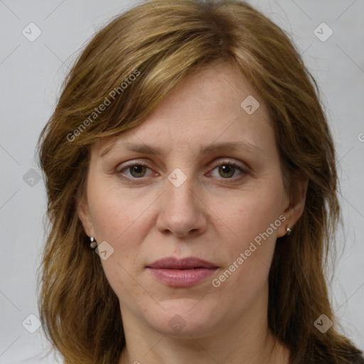 Joyful white adult female with medium  brown hair and grey eyes