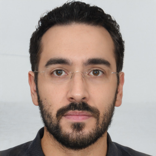 Neutral latino young-adult male with short  black hair and brown eyes