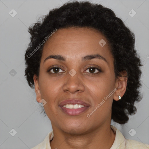 Joyful black adult female with short  brown hair and brown eyes