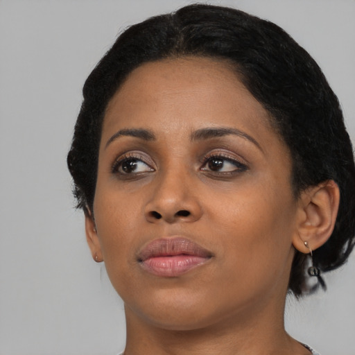 Neutral black young-adult female with short  black hair and brown eyes