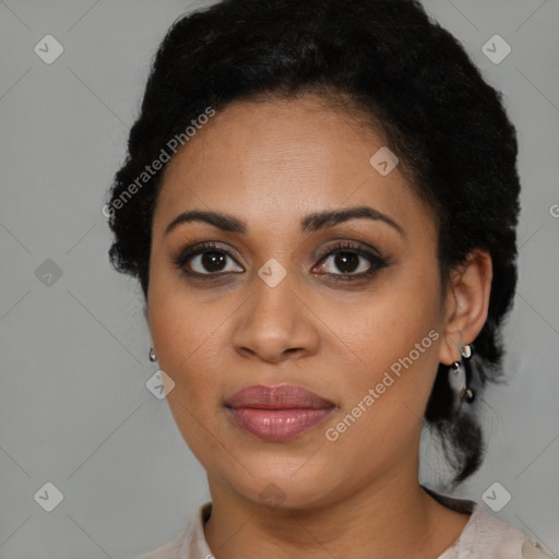 Joyful black young-adult female with short  brown hair and brown eyes