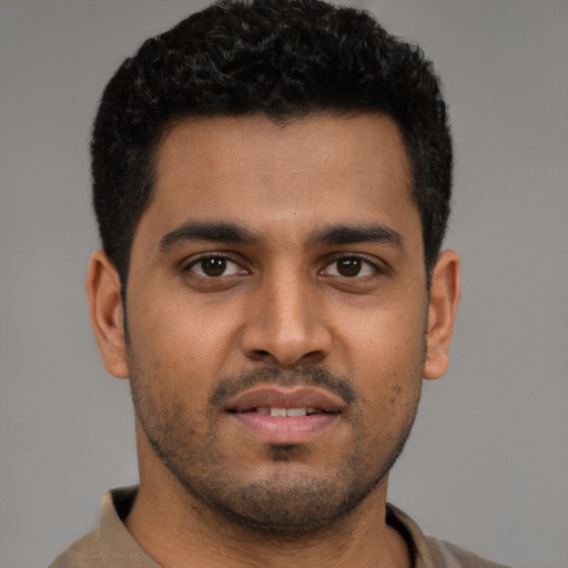 Neutral latino young-adult male with short  black hair and brown eyes