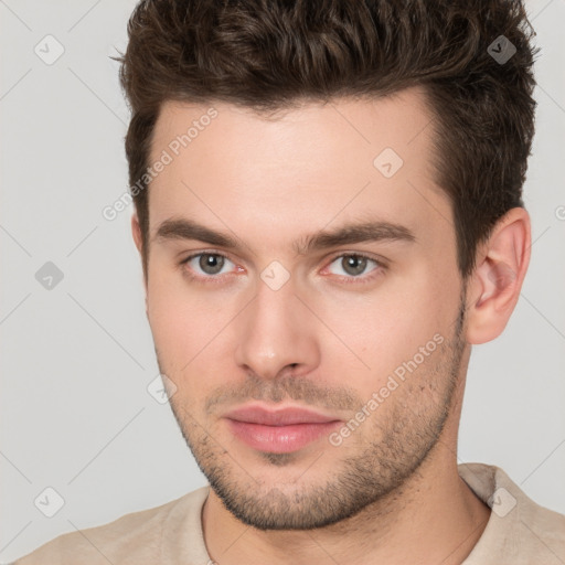 Neutral white young-adult male with short  brown hair and brown eyes