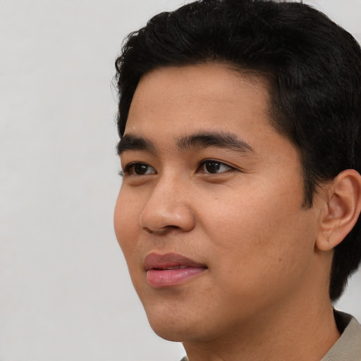 Neutral asian young-adult male with short  black hair and brown eyes