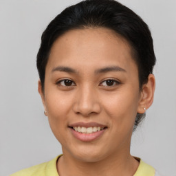 Joyful asian young-adult female with short  brown hair and brown eyes