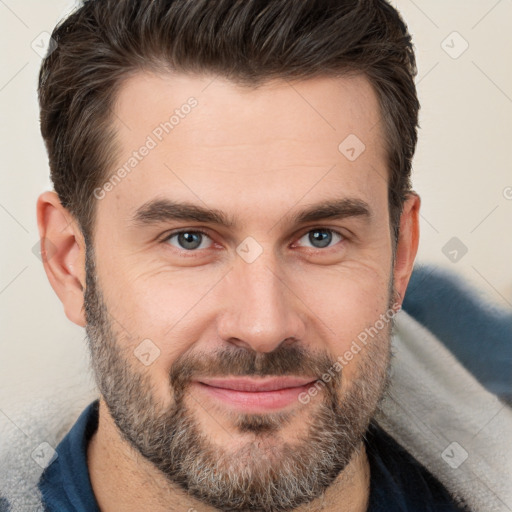 Joyful white adult male with short  brown hair and brown eyes