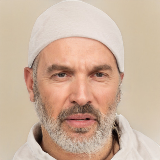 Joyful white middle-aged male with short  gray hair and brown eyes