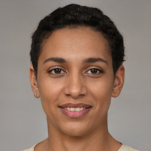 Joyful white young-adult female with short  black hair and brown eyes