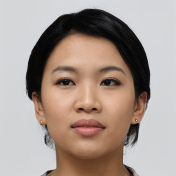 Joyful asian young-adult female with short  black hair and brown eyes