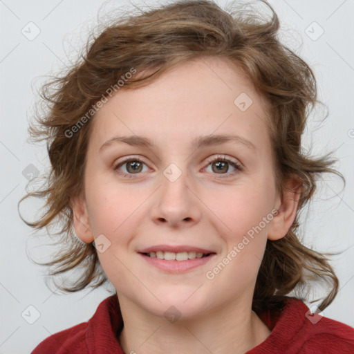 Joyful white young-adult female with medium  brown hair and blue eyes