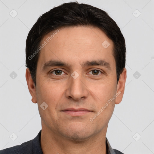 Joyful white adult male with short  brown hair and brown eyes