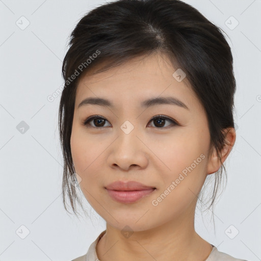 Joyful asian young-adult female with medium  black hair and brown eyes