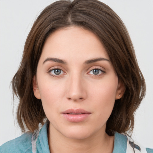 Neutral white young-adult female with medium  brown hair and grey eyes