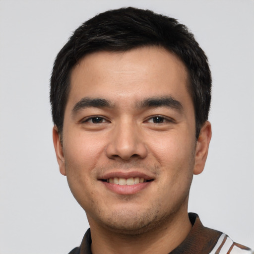Joyful asian young-adult male with short  black hair and brown eyes