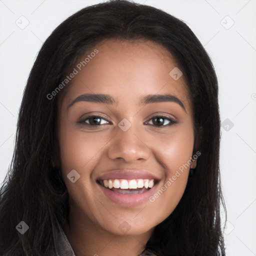 Joyful black young-adult female with long  brown hair and brown eyes