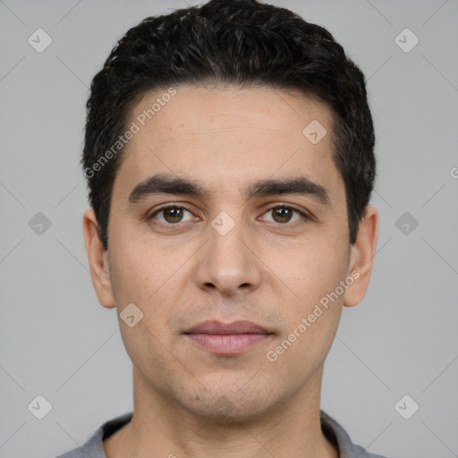 Joyful white young-adult male with short  black hair and brown eyes