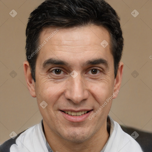 Joyful white adult male with short  black hair and brown eyes