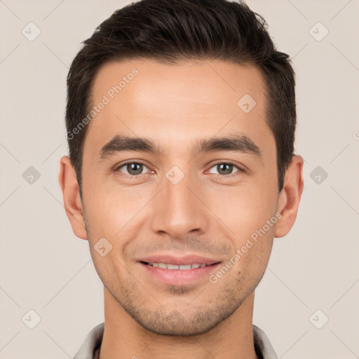 Joyful white young-adult male with short  brown hair and brown eyes