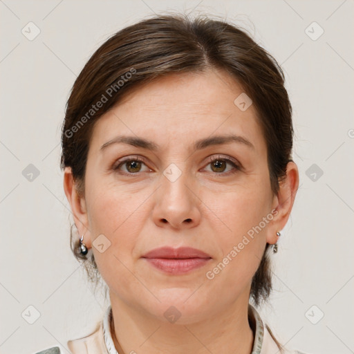 Joyful white adult female with short  brown hair and brown eyes