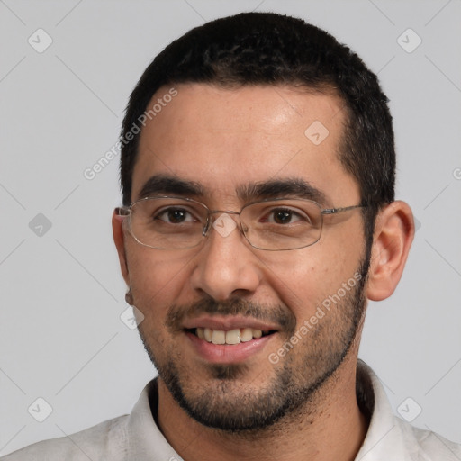 Joyful white young-adult male with short  black hair and brown eyes