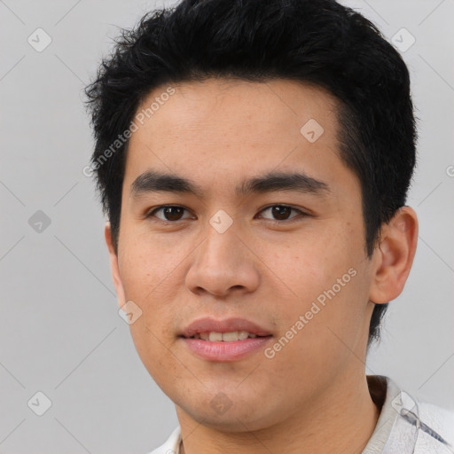 Joyful asian young-adult male with short  black hair and brown eyes