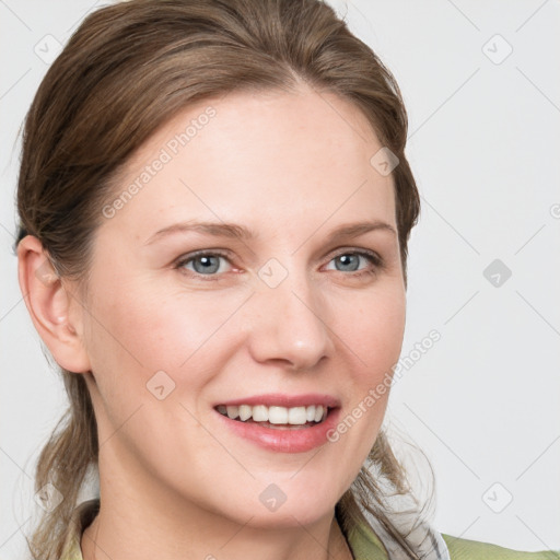 Joyful white young-adult female with medium  brown hair and grey eyes