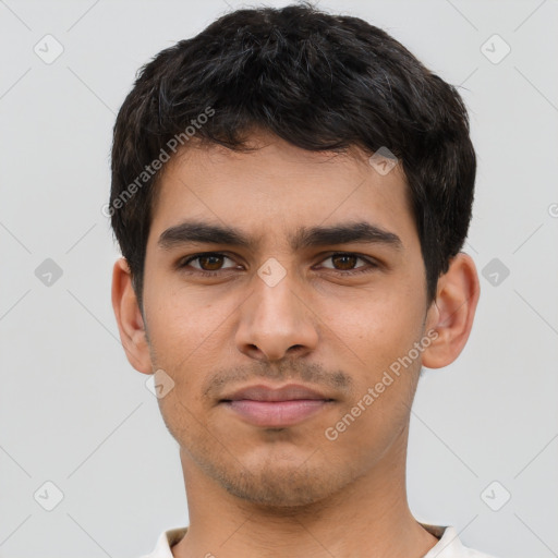 Neutral latino young-adult male with short  black hair and brown eyes