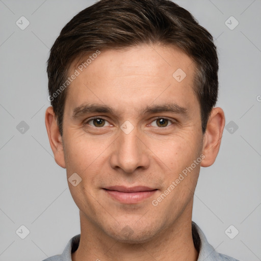 Joyful white young-adult male with short  brown hair and brown eyes