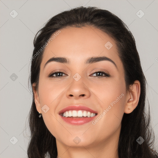 Joyful white young-adult female with long  black hair and brown eyes