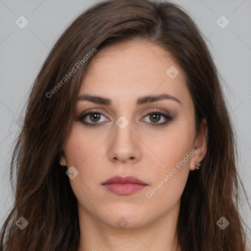 Neutral white young-adult female with long  brown hair and brown eyes