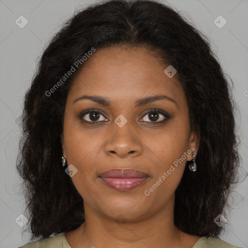 Joyful black young-adult female with long  brown hair and brown eyes