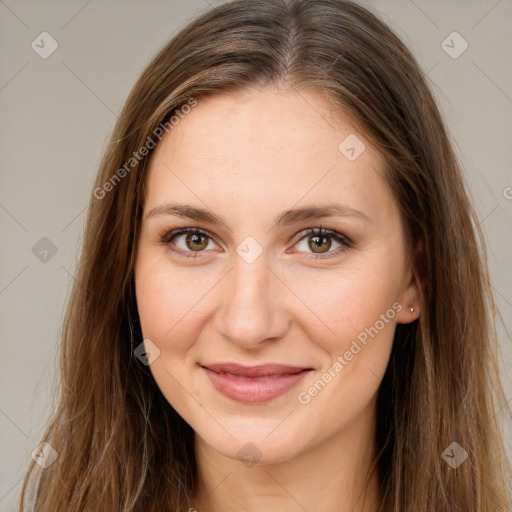 Joyful white young-adult female with long  brown hair and green eyes