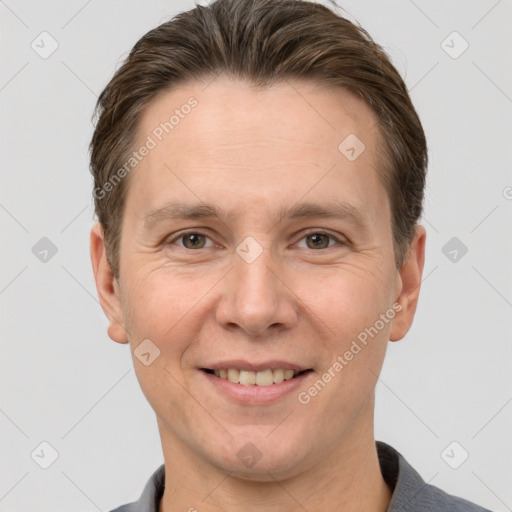 Joyful white adult male with short  brown hair and grey eyes