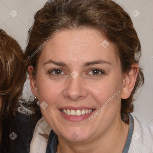 Joyful white adult female with medium  brown hair and blue eyes