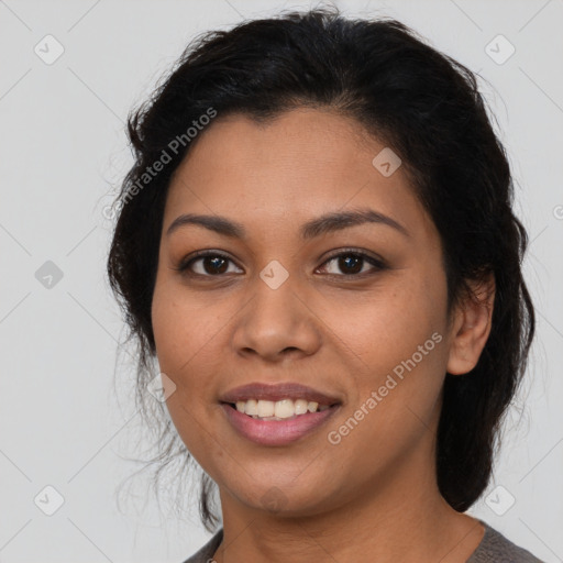 Joyful latino young-adult female with medium  brown hair and brown eyes