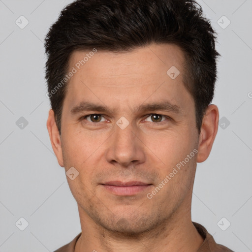 Joyful white adult male with short  brown hair and brown eyes