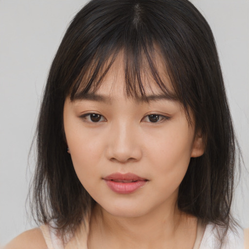 Neutral asian young-adult female with medium  brown hair and brown eyes